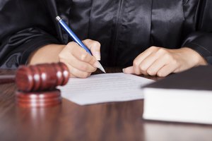 Female Judge Writing On Paper