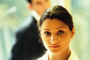 Young woman with man in background