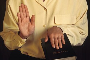 Person swearing on Bible