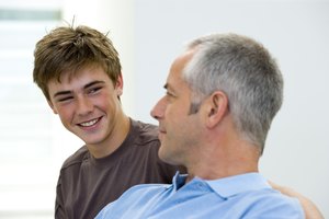 Smiling teenager with parent