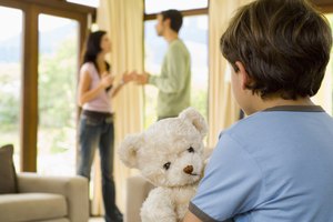 Boy with teddy bear and parents fighting