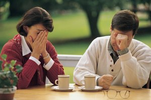 Couple at table looking upset