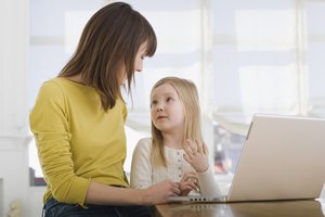 Mother and daughter on laptop computer