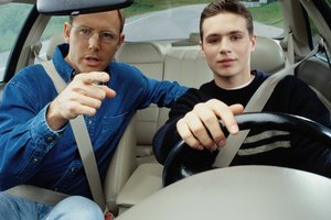 Man Teaching a Boy How to Drive
