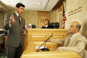 Side profile of a lawyer and a witness on the witness stand