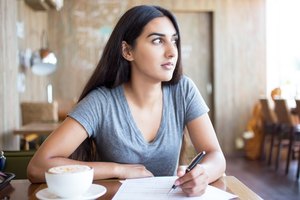 Pensive student accomplishing task