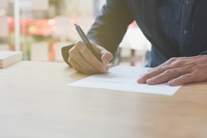 businessman signing contract document making a deal at office, business agreement, cooperation concept