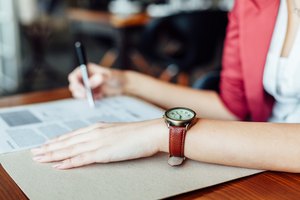 Woman with leather wristwatch in closeup