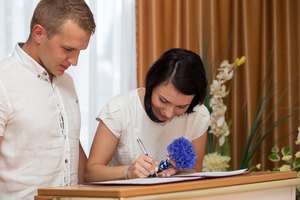 groom and bride in the registry office get married