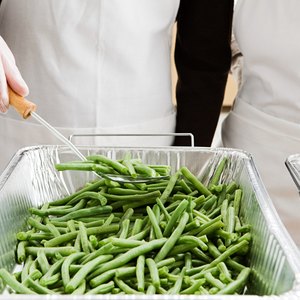 Dishing out food at the soup kitchen.