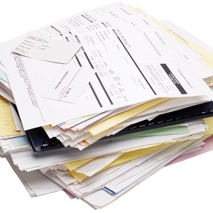 Stack of medical bills and receipts.