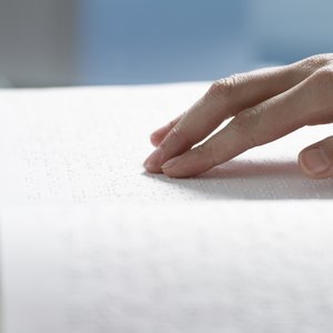 Woman reading braille