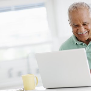 40 year old man looking at bank accounts online