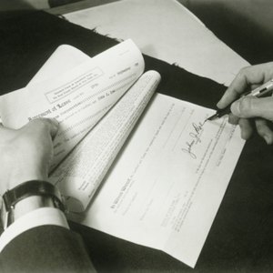 Your obligations under an expired lease continue until a new lease is signed.
