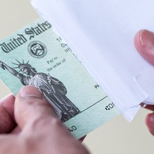 Can I Deposit My Paper Tax Refund Check in My Relative's Bank Account?