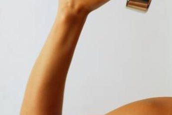 Dumbbells add resistance to a scarecrow workout.