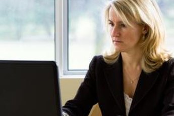 A computer and a calculator are staple tools for a bookkeeper.