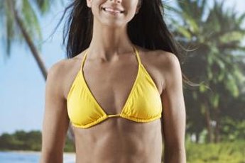 A bikini will show off your abs.