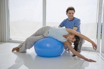 Use an exercise ball for a lateral waist exercise.