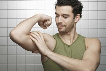Build your biceps at home with towel exercises.