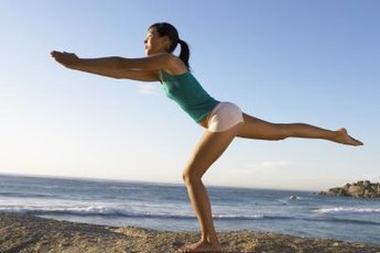 Standing balance exercises target your abs and legs simultaneously.