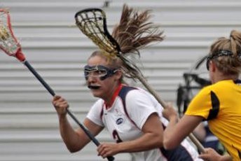 Towson's Katie Cloud, right, keeps her stick high while defending an attacker.