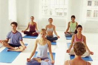 Women benefit from stress relief in yoga class.