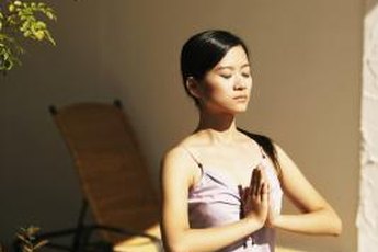 Prayer pose is the first position in Suyra Namaskar.
