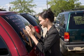 Sign on the dotted line to transfer the title of your car to a new owner.