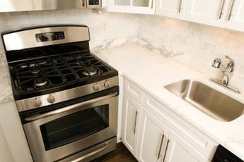 Secondhand appliances in good condition save money on the kitchen makeover.