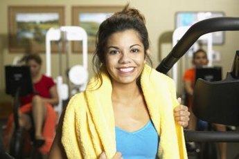 Working out with weighted plates requires additional grip strength.