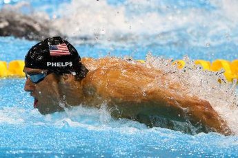 Michael Phelps swims the butterfly stroke in the 2012 Olympic medley relay.