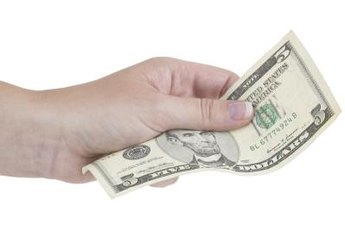 During the recession, Americans started cutting their credit card debt and started keeping more cash handy, according to the Federal Reserve.