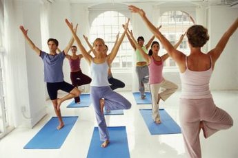 A yoga class promotes team building.