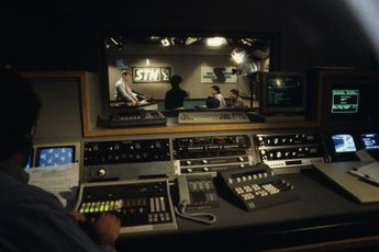 A TV scenic design supervisor must balance lighting with the placement of props and actors.