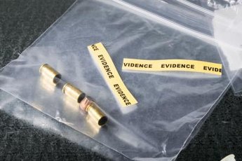 Crime scenes are common spots for on-the-job forensic ballistics analysts.