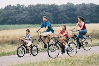 Bike riding is an inexpensive activity on a family vacation.