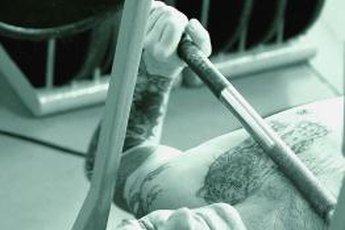 The close-grip bench press works your total triceps.
