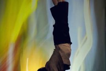 The handstand position develops arm and shoulder strength.