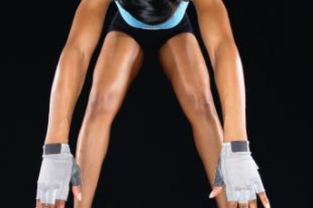During front squat, the barbell rests at the front of your upper shoulders.