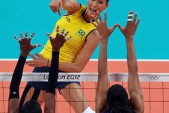 Jaqueline Carvalho of Brazil spikes the ball against the U.S. women's squad in Olympic play in London.