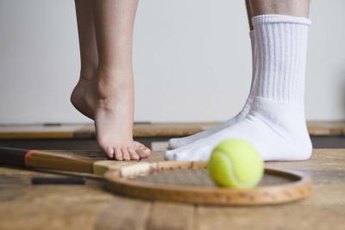Standing on your tip toes repeatedly is another way to strengthen your arches.