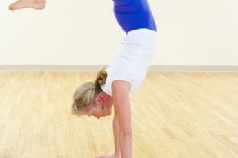 Handstands build arm muscles.
