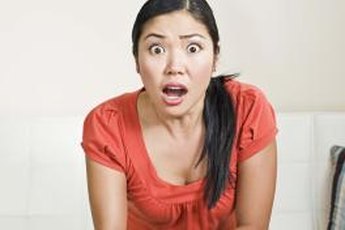 High estrogen can cause mood swings and water retention.