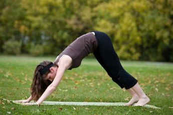 Downward Facing Dog pose can alleviate discomfort from sitting all day.