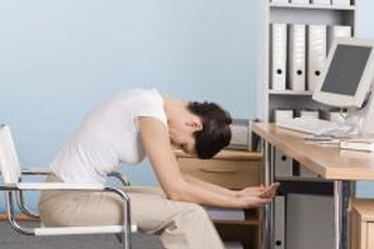 Do exercises at your desk to strengthen your back.