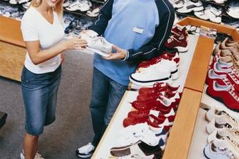 Visit a sporting goods store to try on aerobic shoes.