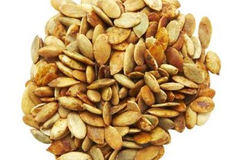 Pumpkin seeds contain trace amounts of vitamins that contribute to overall health.