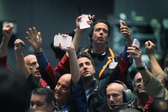 Gold futures trade both on the commodity exchange floors and electronically.