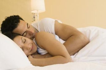 Few couples actually sleep tightly entwined.